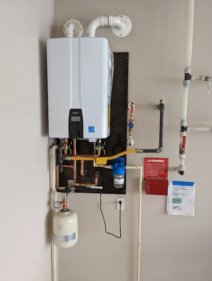 Professional plumber installing copper piping in a Lake Delton home